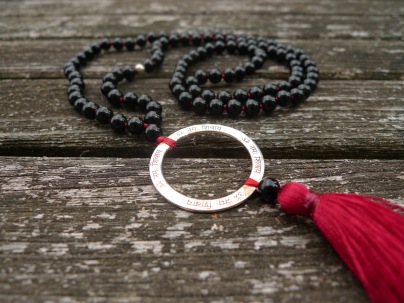 Śiva mala - black onyx on red thread with OM NAMAH SHIVAYA silver ring